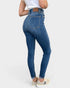 Person wearing blue jeans on a white background