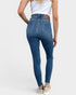 Person wearing blue jeans on a white background