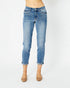Blue jeans worn by a person on a white background