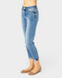 Light blue jeans worn by a person on a white background