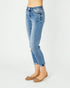 Light blue jeans worn by a person on a white background
