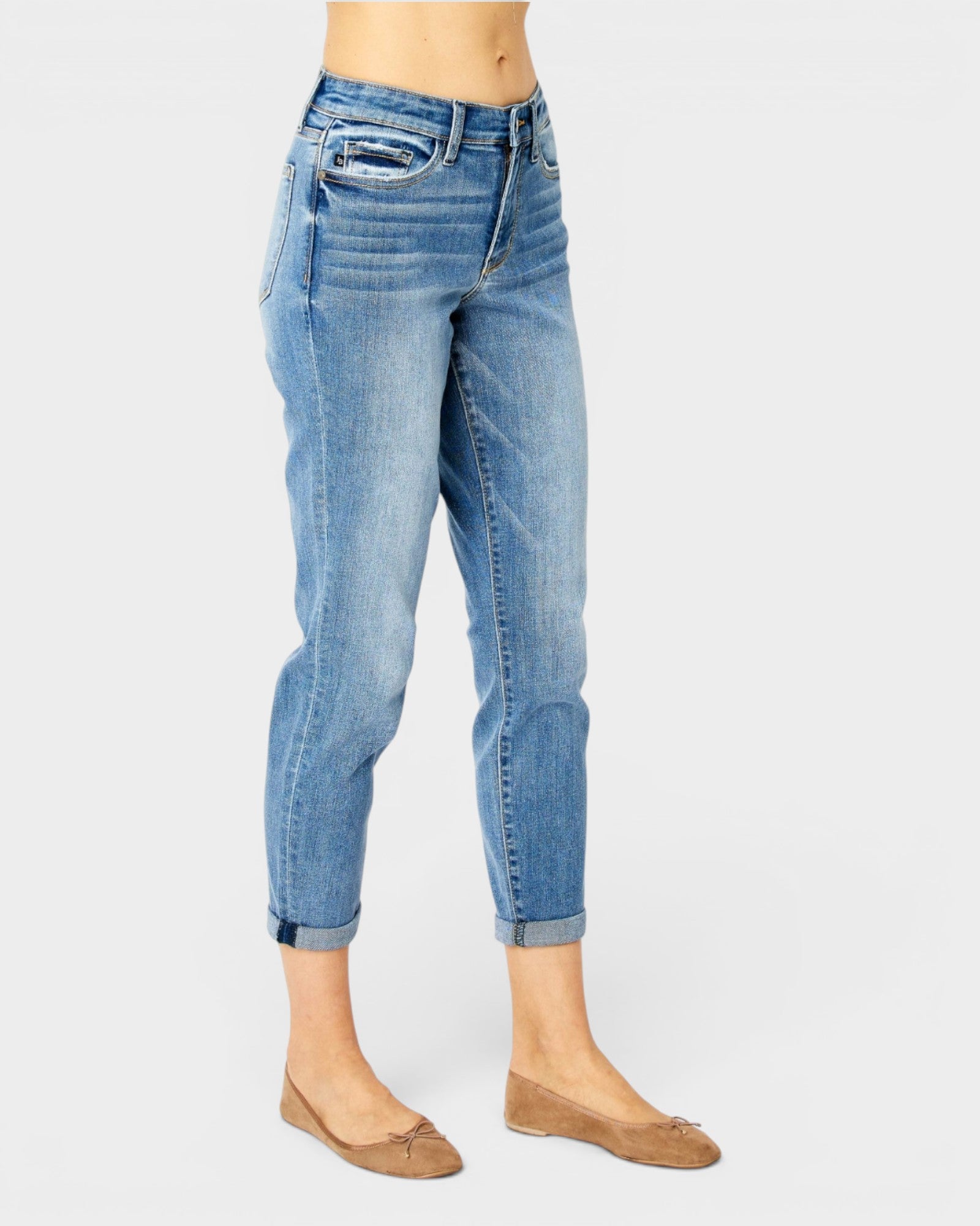 Light blue jeans worn by a person on a white background