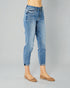 Blue jeans worn by a person on a gray background
