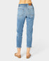 Light blue jeans worn by a person on a white background