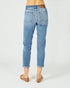 Light blue jeans worn by a person on a white background