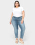 Woman wearing blue jeans and a white t-shirt on a white background
