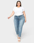 Woman wearing a white t-shirt and light blue jeans on a white background