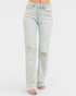 Light blue jeans with slight distressing on a white background