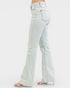 Light blue flared jeans on a white background