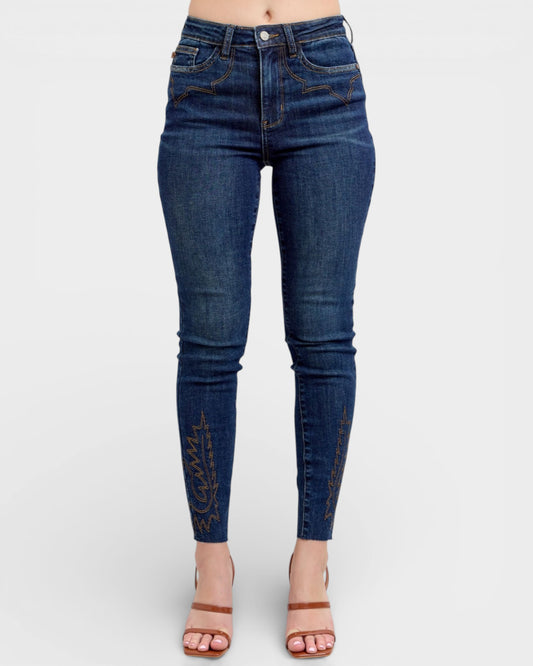 Blue jeans worn by a person on a white background