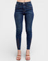 Blue jeans worn by a person on a white background