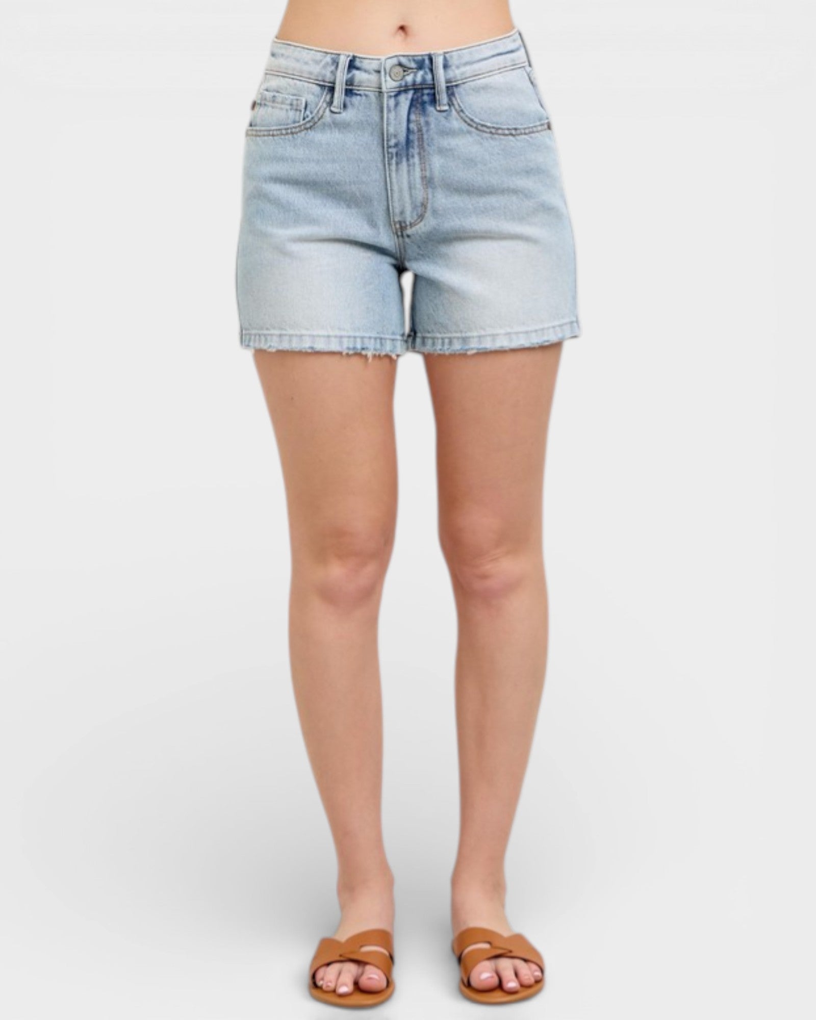 Light blue denim shorts worn by a person on a white background