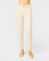 Beige jeans worn by a person on a white background