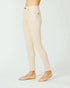 Beige pants worn by a person on a white background