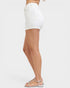 White shorts worn by a person on a white background