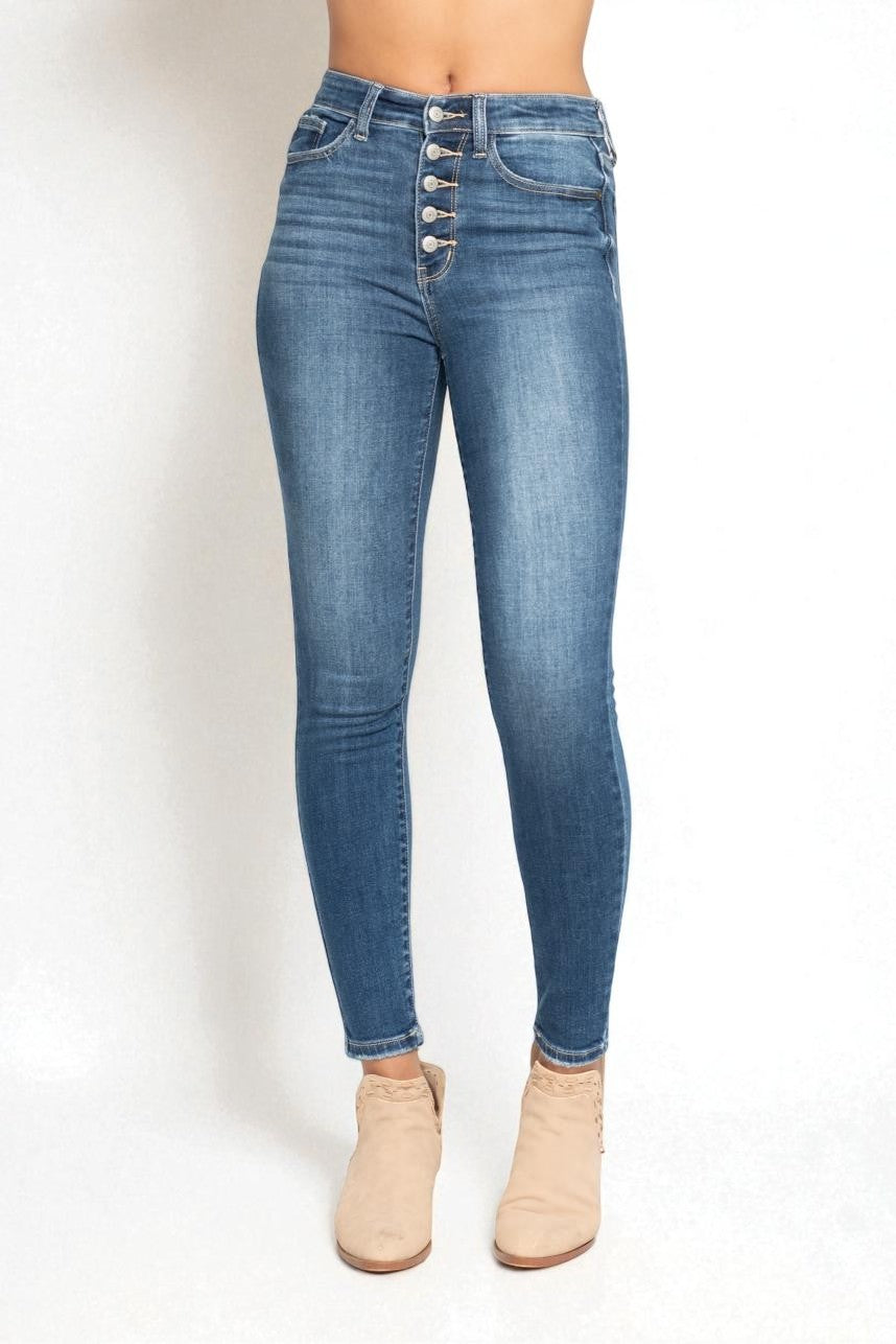 Blue jeans worn by a person on a white background