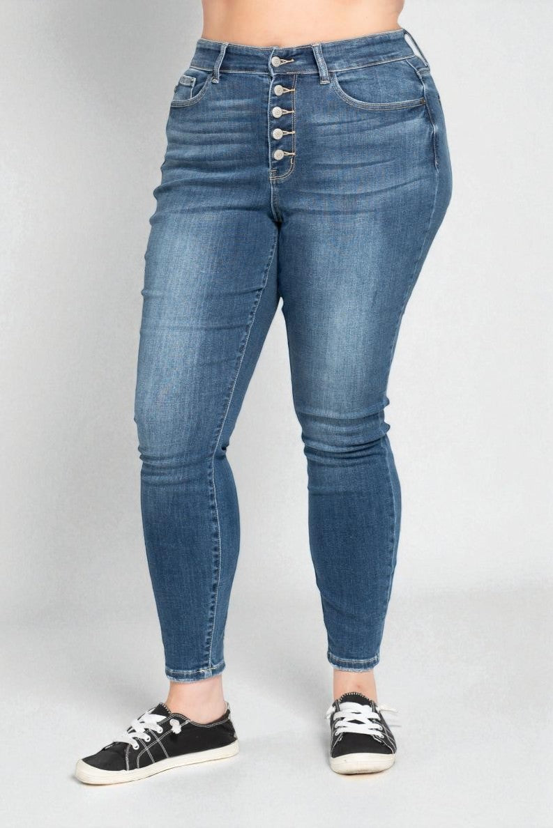 Blue jeans worn by a person on a white background