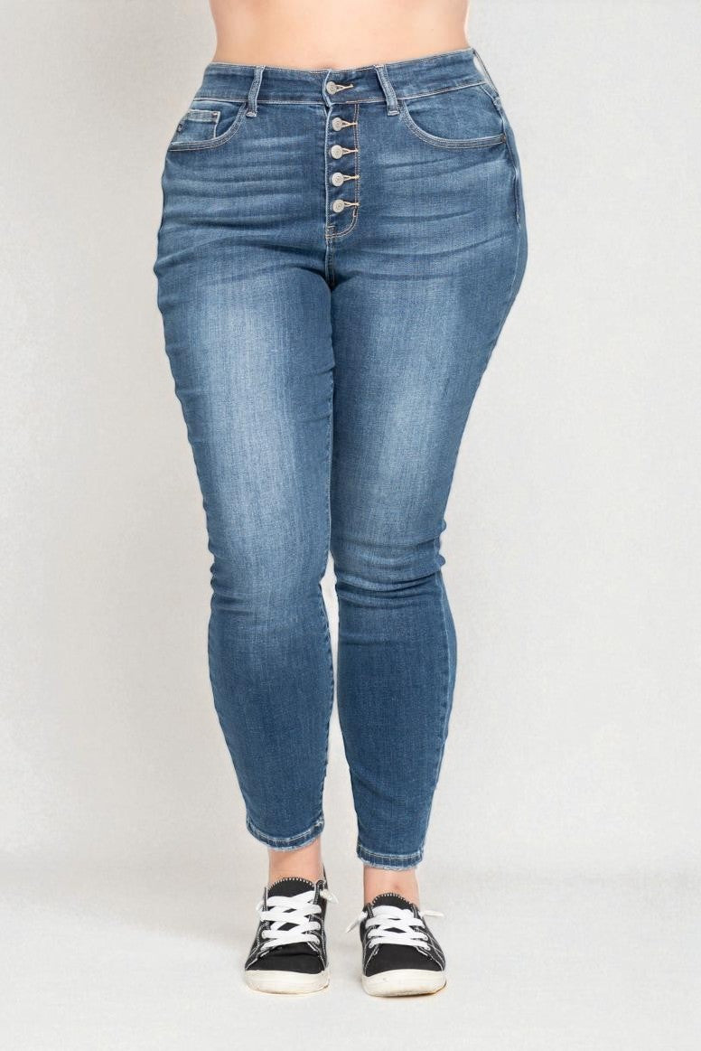 Blue jeans worn by a person on a white background
