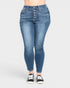 Blue jeans worn by a person on a white background