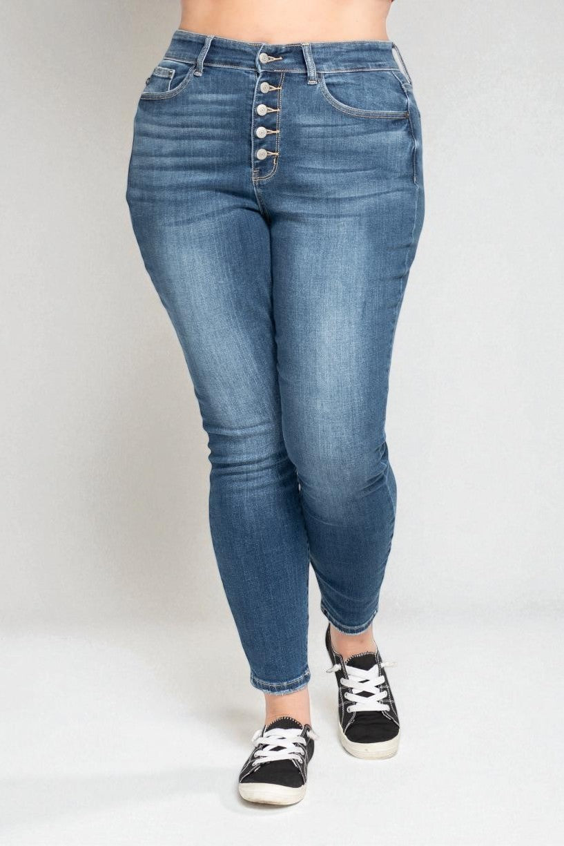 Blue jeans worn by a person on a white background
