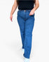 A person wearing medium-wash blue denim jeans with a black top and white socks, shown from the chest down against a plain light gray studio background.