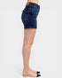 Denim shorts worn by a person on a white background