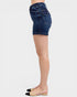Denim shorts worn by a person on a white background