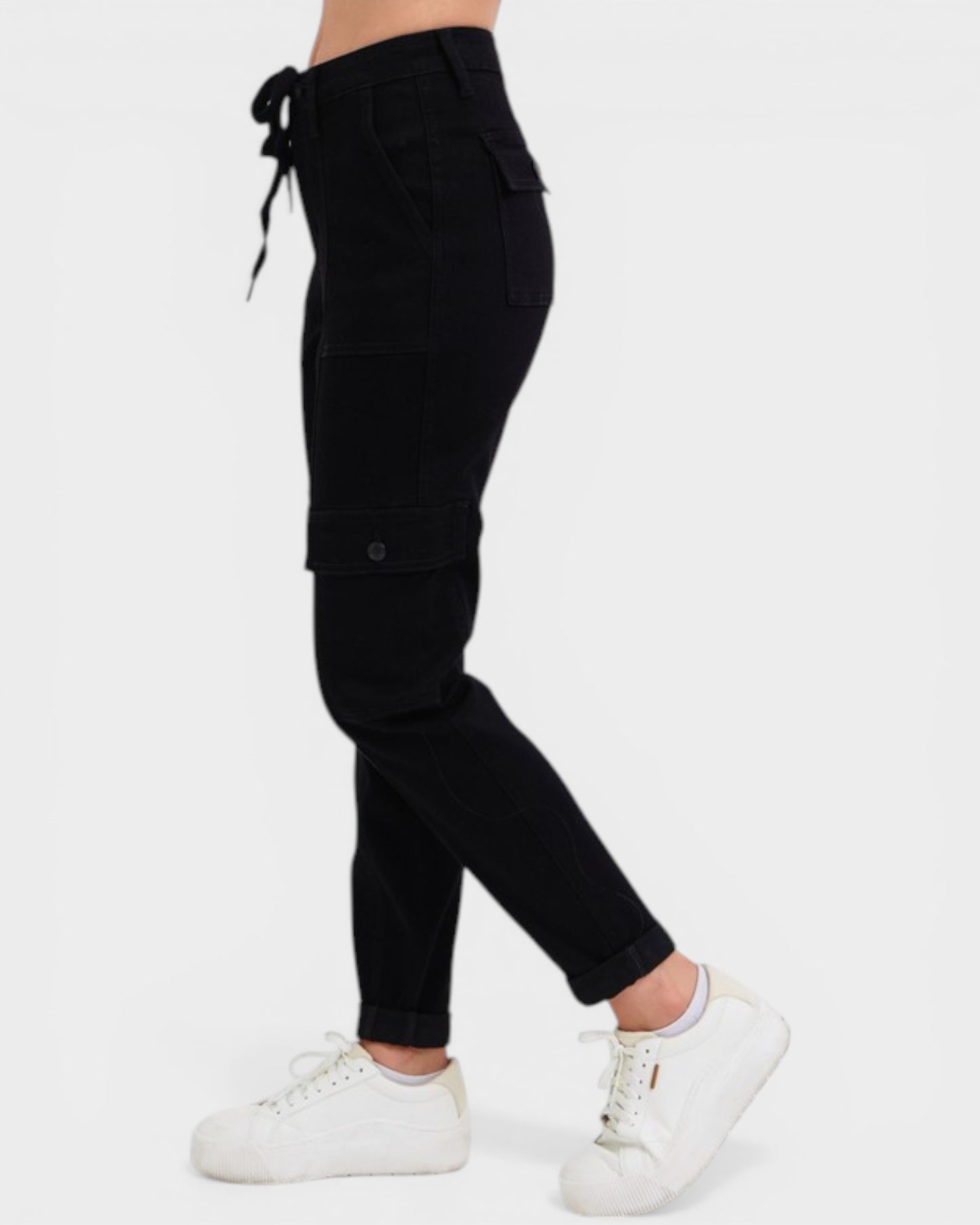 Black cargo jogger pants worn by a person on a white background