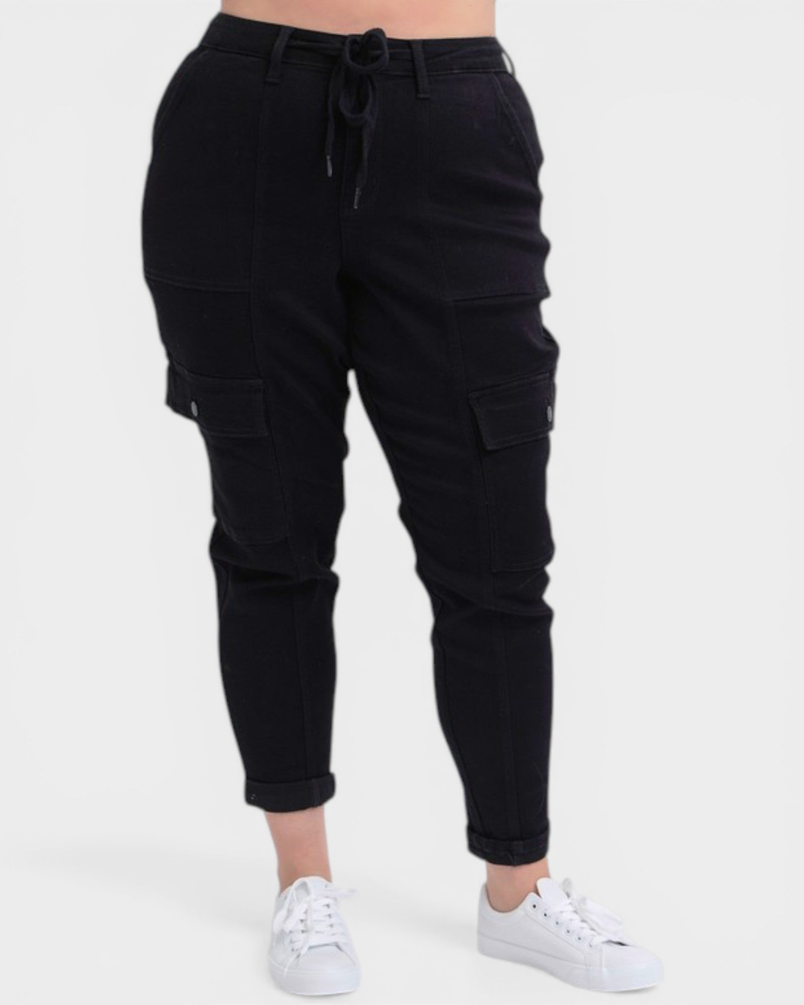 Black cargo jogger pants worn by a person on a white background