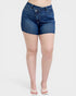 Person wearing blue denim shorts on a white background