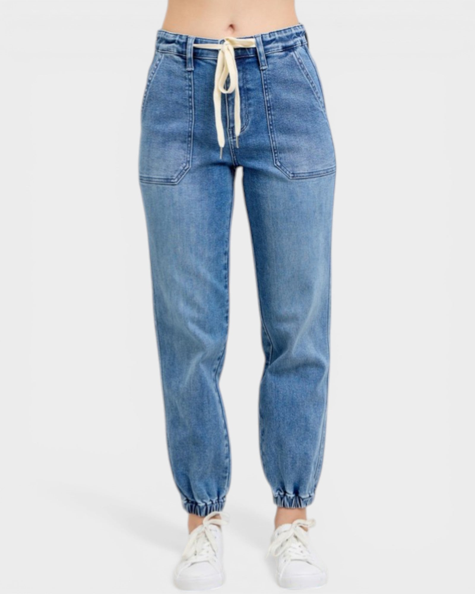 Blue jeans with a drawstring waist on a white background