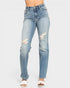 Light blue jeans with distressing on a white background