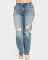 Blue jeans with distressing on a white background