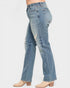 Light blue jeans with slight distressing on a white background