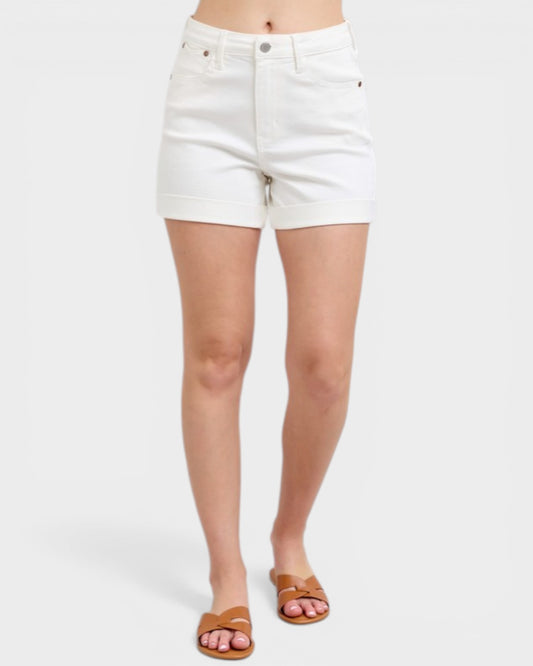 White denim shorts worn by a person on a white background