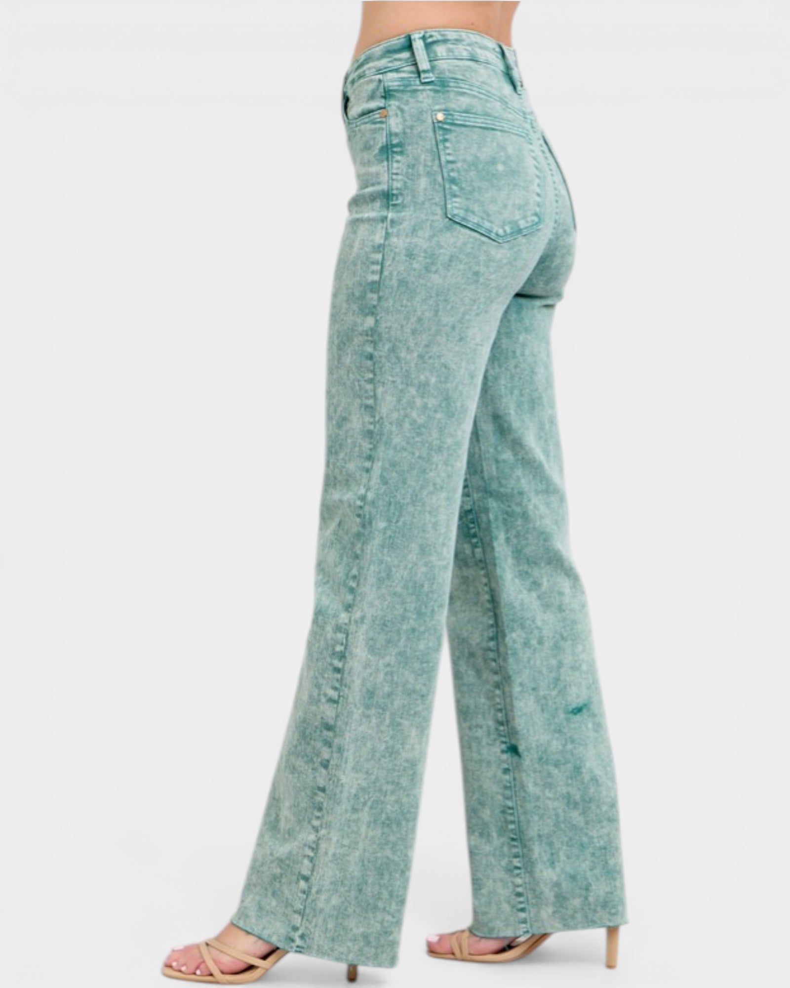 Teal acid-wash jeans on a white background