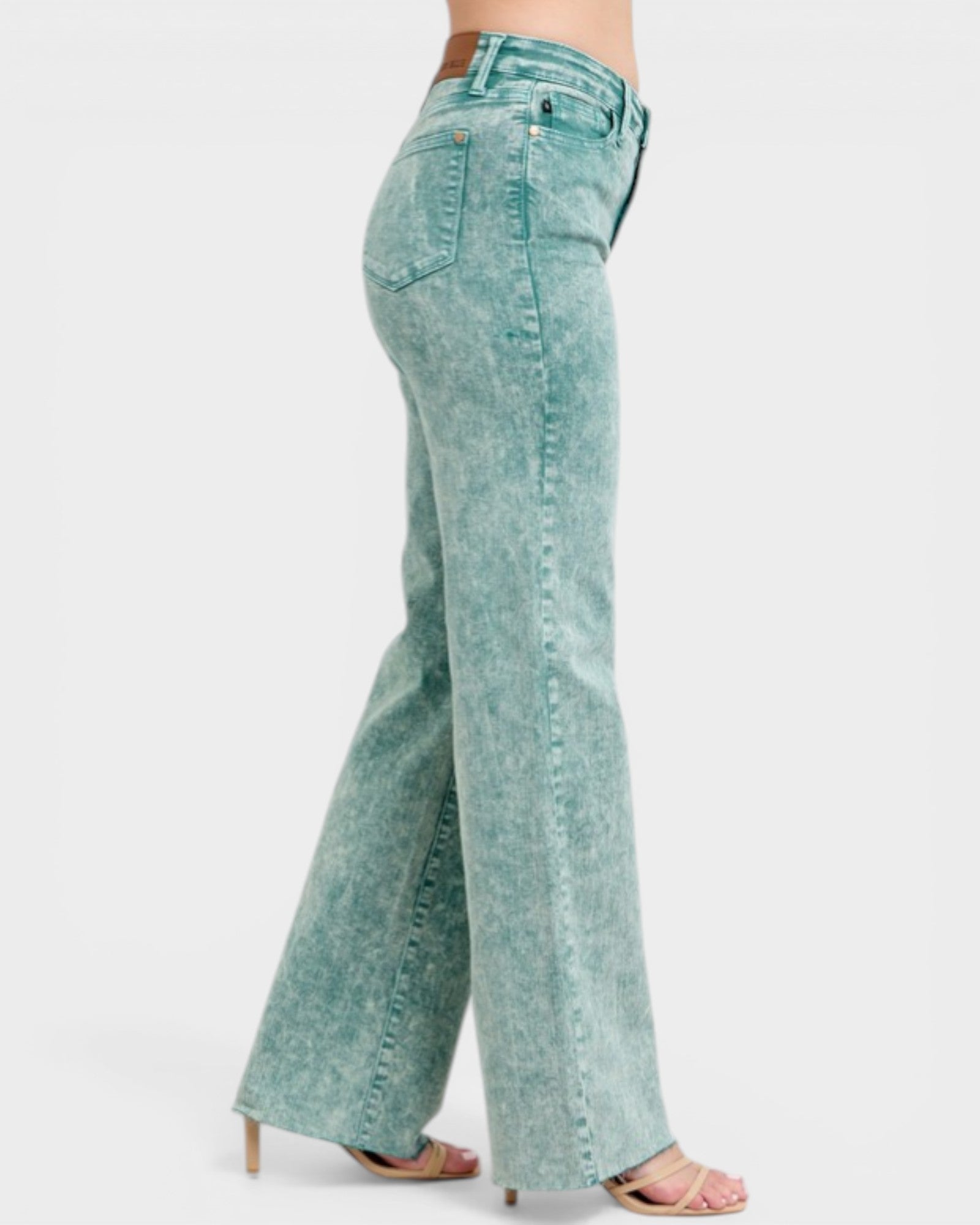 Light blue jeans worn by a person on a white background