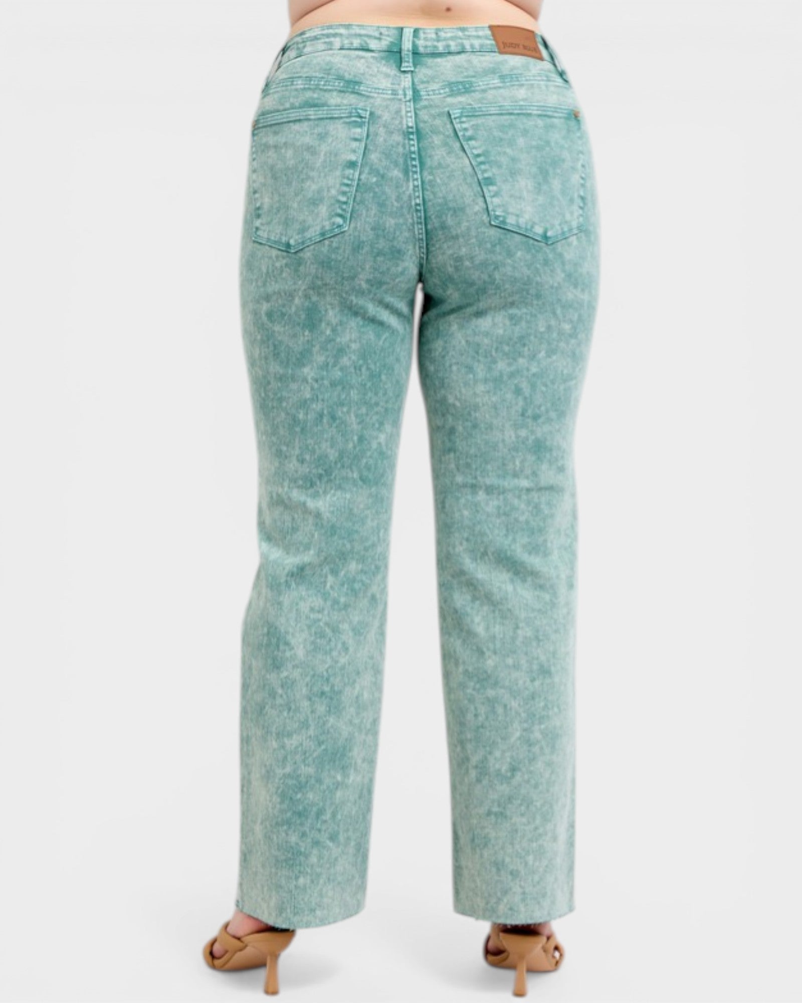 Teal acid-wash jeans on a white background