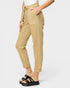 Beige pants worn by a person on a white background