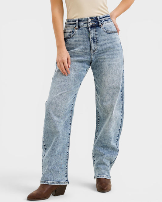 Light blue jeans worn by a person on a white background