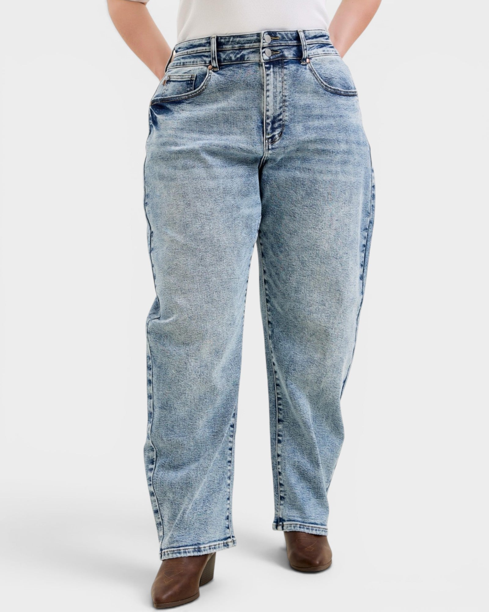 Light blue jeans worn by a person on a white background