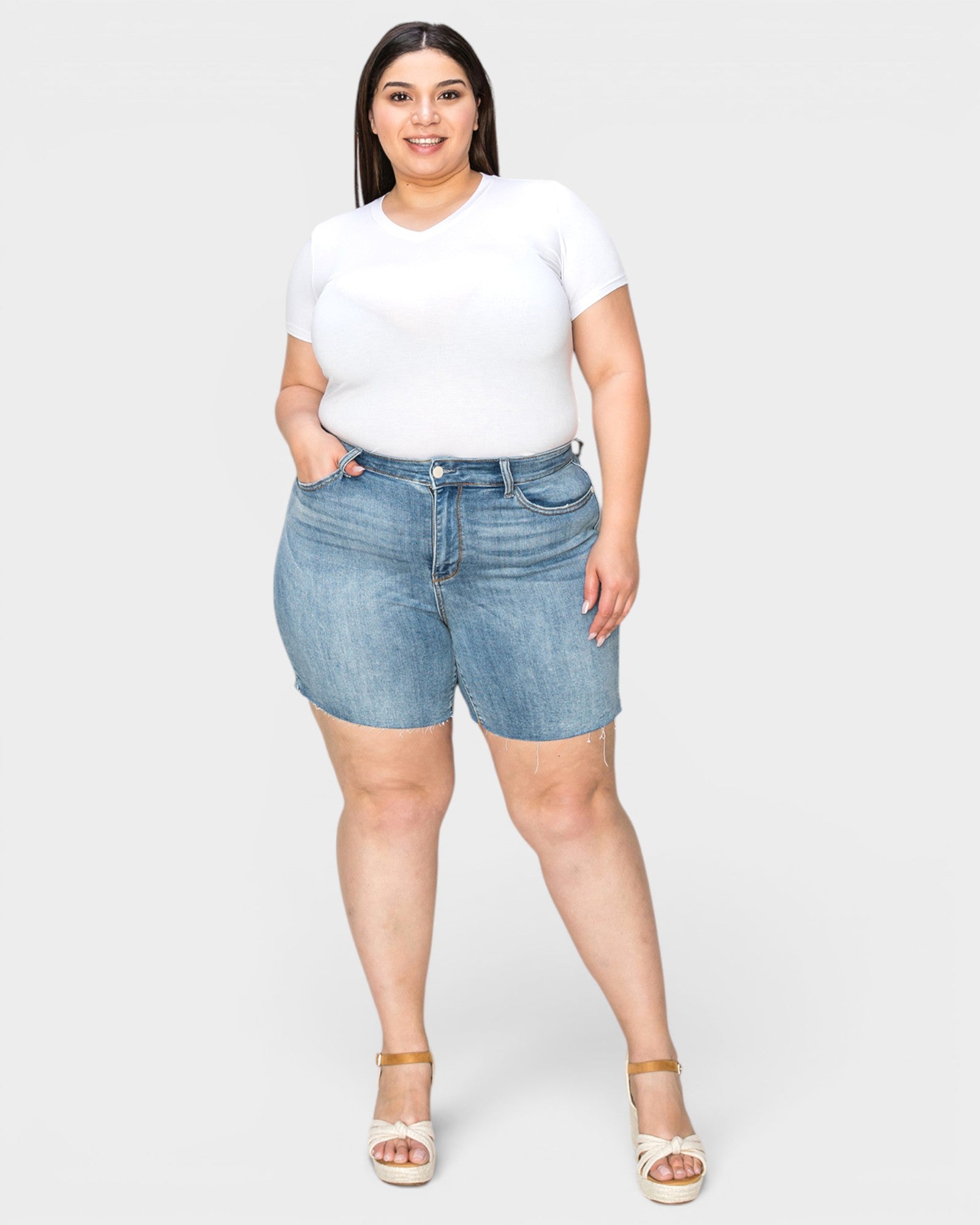 Medium Wash High-Rise Raw Hem Denim Shorts