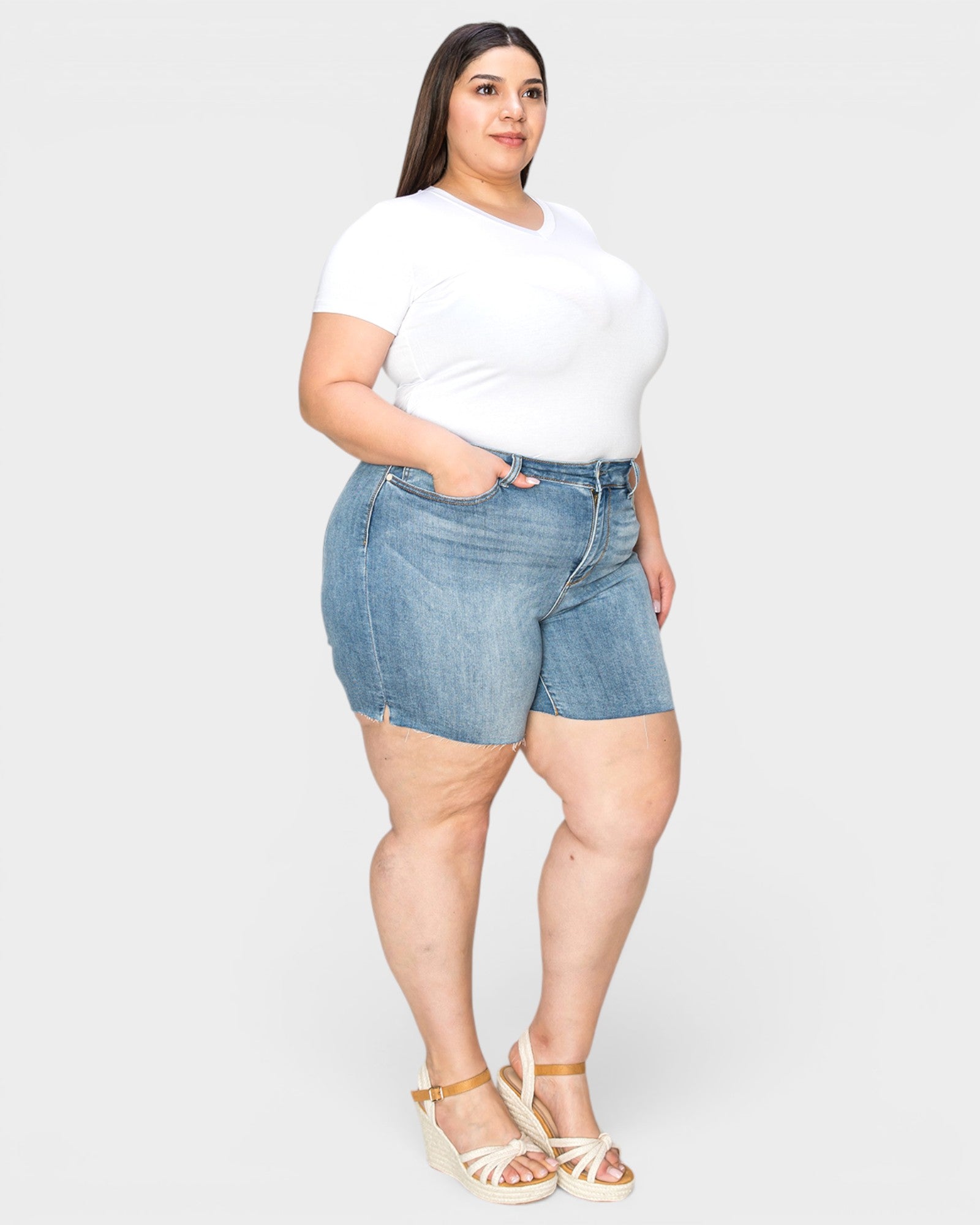 Medium Wash High-Rise Raw Hem Denim Shorts