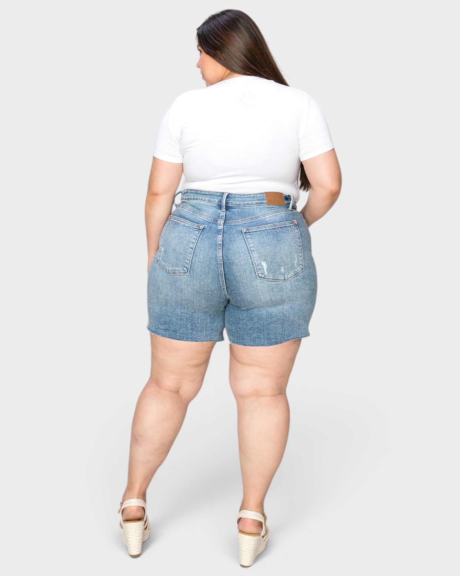 Medium Wash High-Rise Raw Hem Denim Shorts