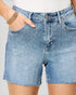 Denim shorts with rhinestone embellishments on a plain background