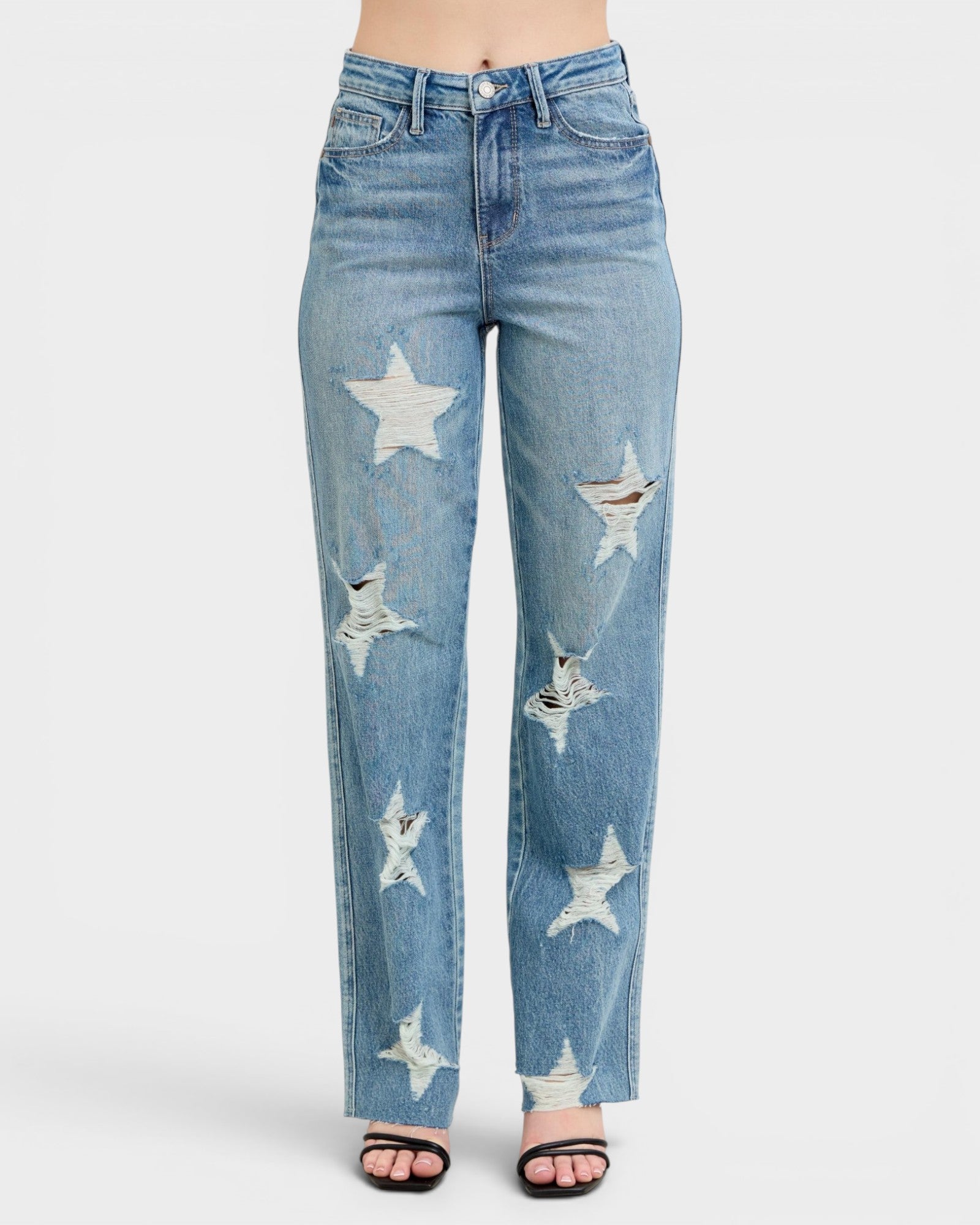 Blue jeans with star designs on a white background