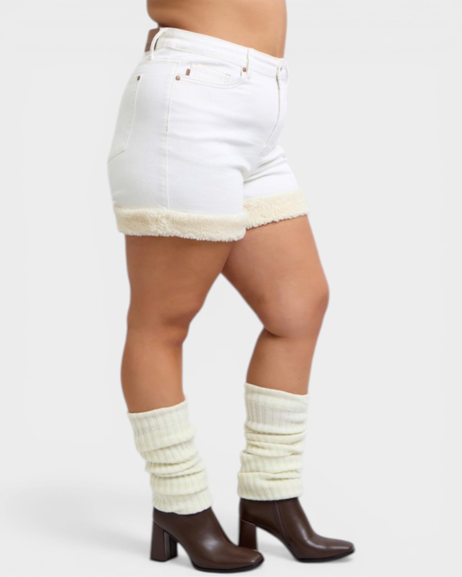 White lace-trimmed shorts worn by a person on a white background