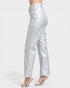 Silver pants worn by a person on a white background