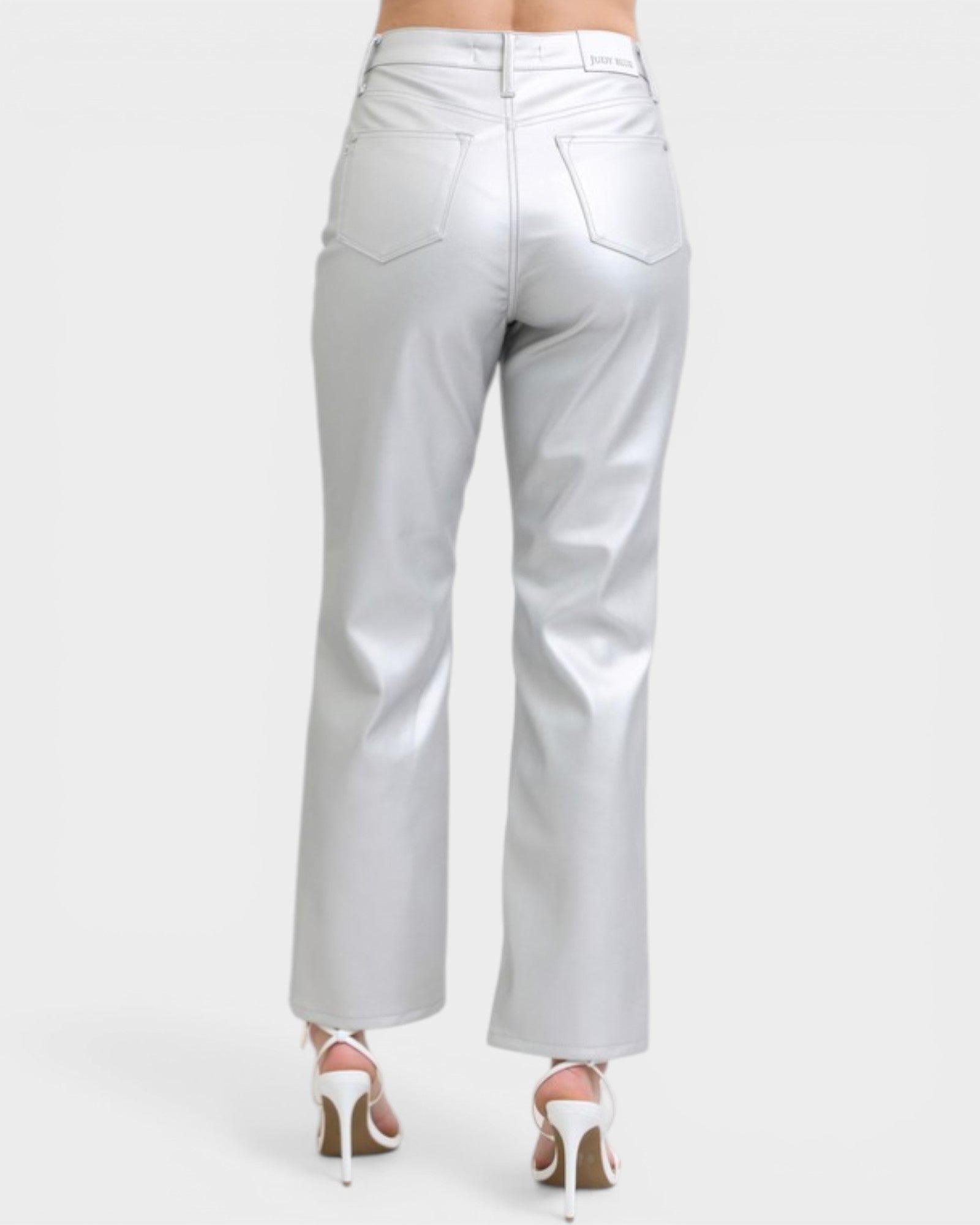 Silver metallic pants on a white background