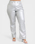 Silver metallic pants worn by a person on a white background